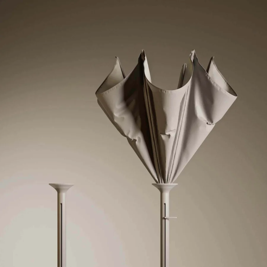 Distinguished Royal Botania Anamon sunshade with draped textile and slender metal stem in a light beige matte finish