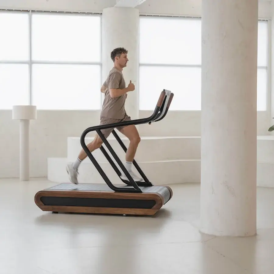 Distinguished NOHRD Citius treadmill crafted with fine woods and dark metal in a matte finish delivers a natural running experience