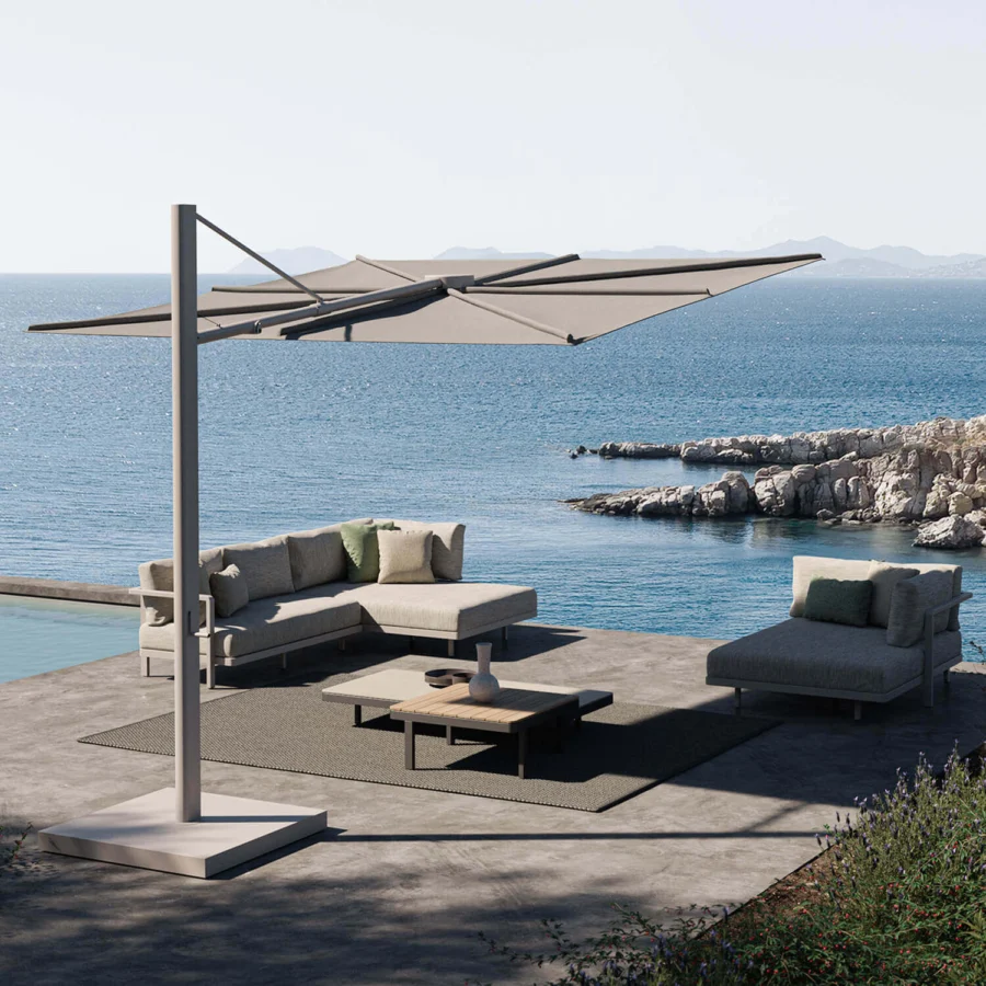 Elegant Royal Botania Solaz umbrella with a light-colored metal frame and neutral beige textile canopy