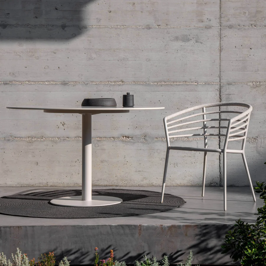Sophisticated Royal Botania Archy armchair crafted with textured pale synthetic material and integrated sleeves wrapping a tubular backrest