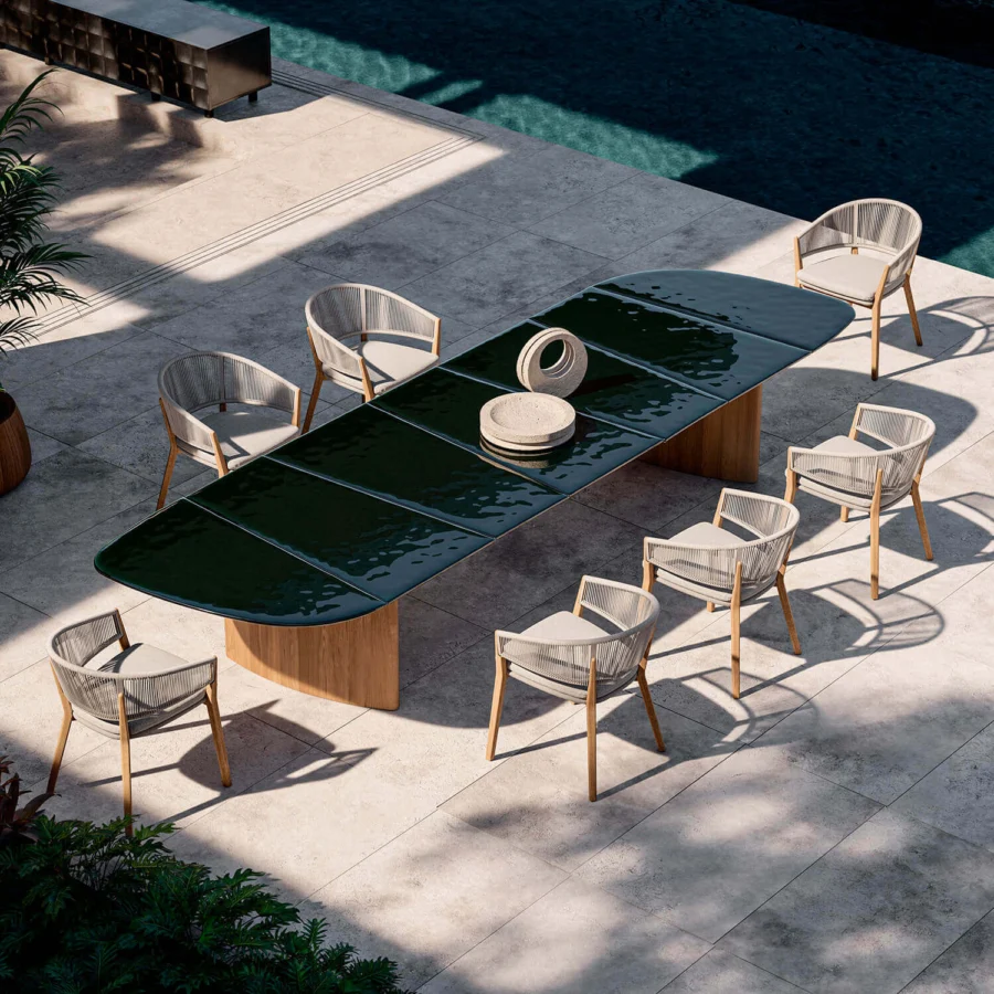 Exceptional Royal Botania Regaliz table with dark green glass crafted using a melting technique and gracefully curved teak bases