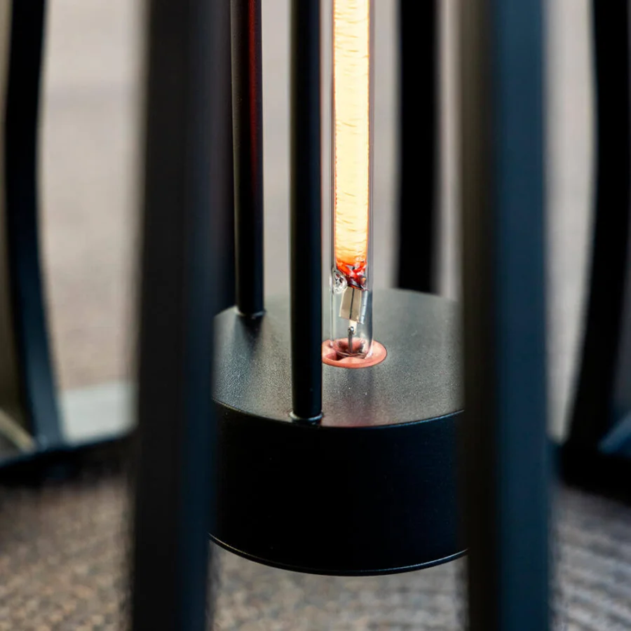 Exceptional Royal Botania Furniz table with a cage-like structure built in dark-toned metal and matte finish illuminated by a vintage Edison bulb