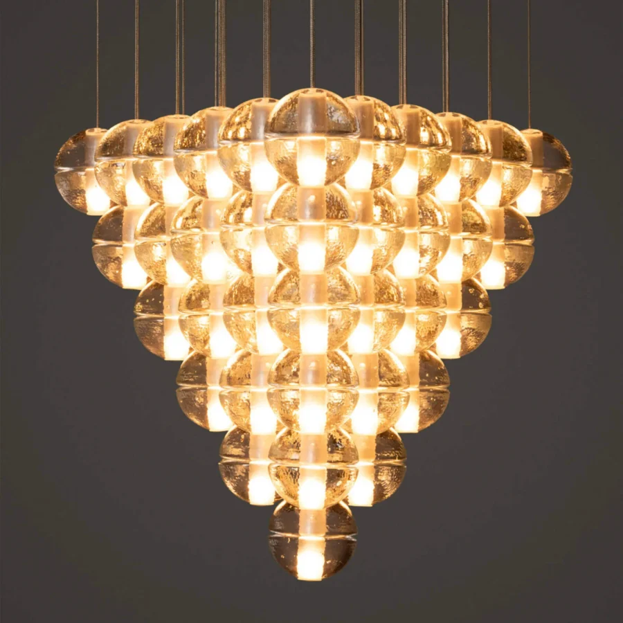Exceptional Bocci 14 Geometric suspension lamp with translucent glass spheres and delicate metallic cables emitting a warm amber glow