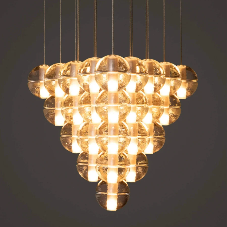 Elegant Bocci 14 Geometric suspension lamp with clustered glass spheres and textured matte finish emitting golden light