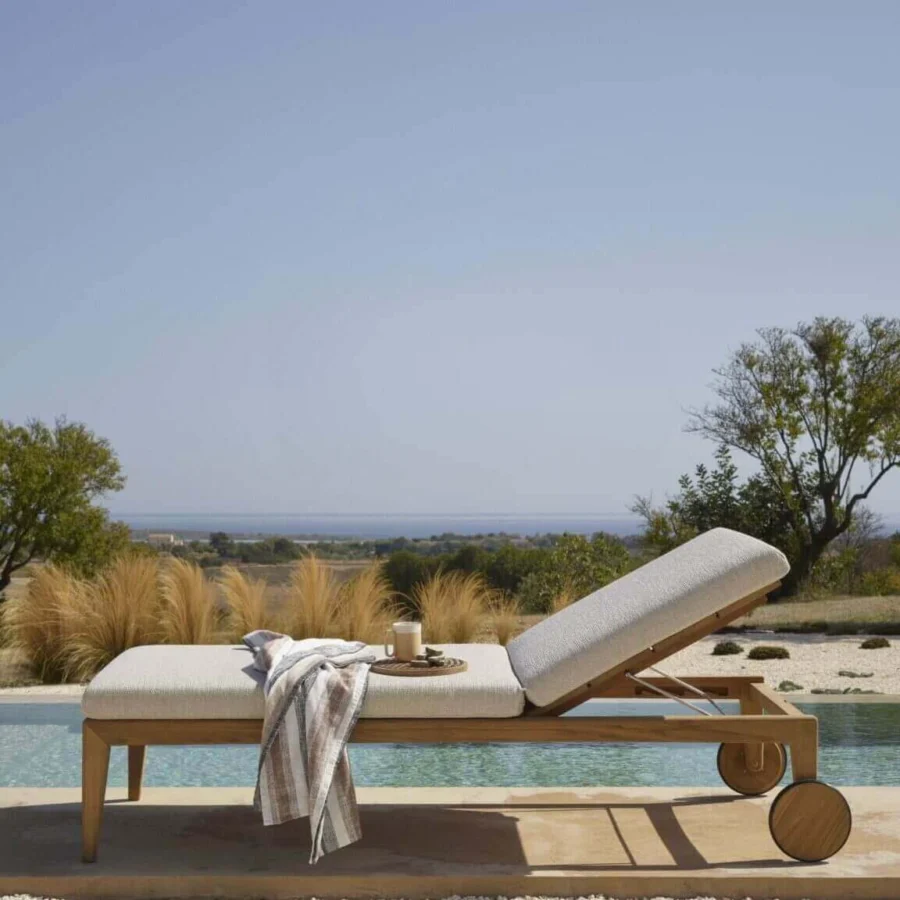 Exceptional Royal Botania Zenhit lounger built with teak wood and light gray textile upholstery for comfortable relaxation