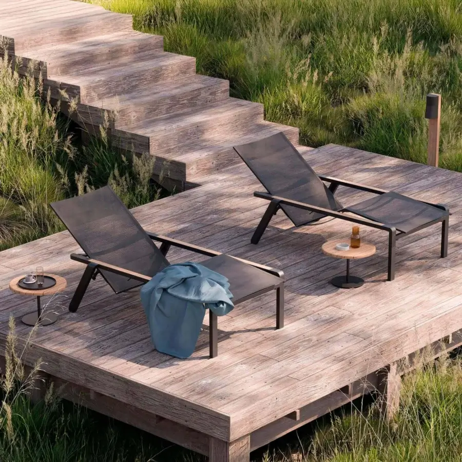 Exceptional Royal Botania Alura lounger with dark grey woven textile and lighter wood armrests in a sleek matte finish