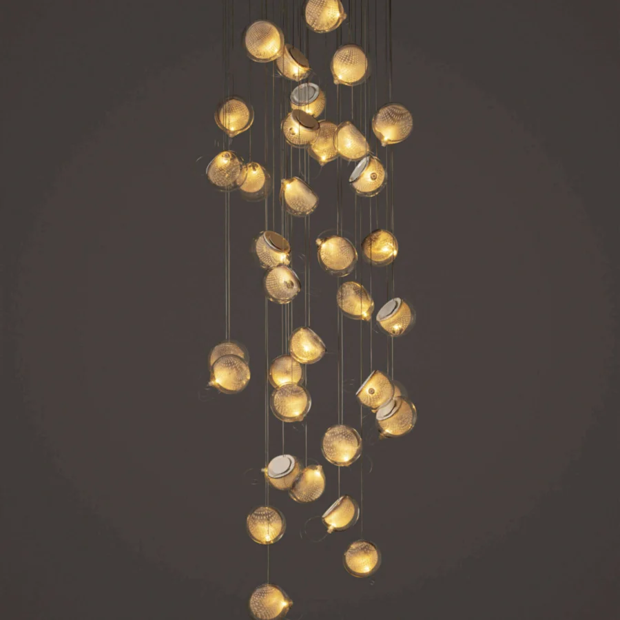Superior Bocci 76 Random suspension lamp with cascading glass spheres encased in a warm gold toned metal cage and white powder coating