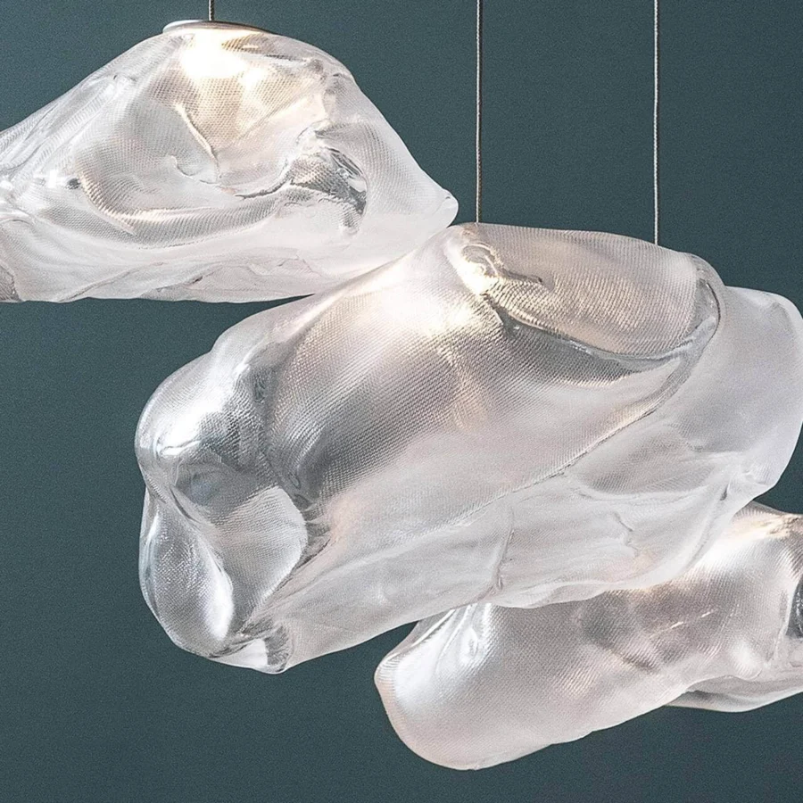 Exclusive Bocci 73 suspension lamp with translucent hand-blown glass pendants creating subtle tonal variations when illuminated