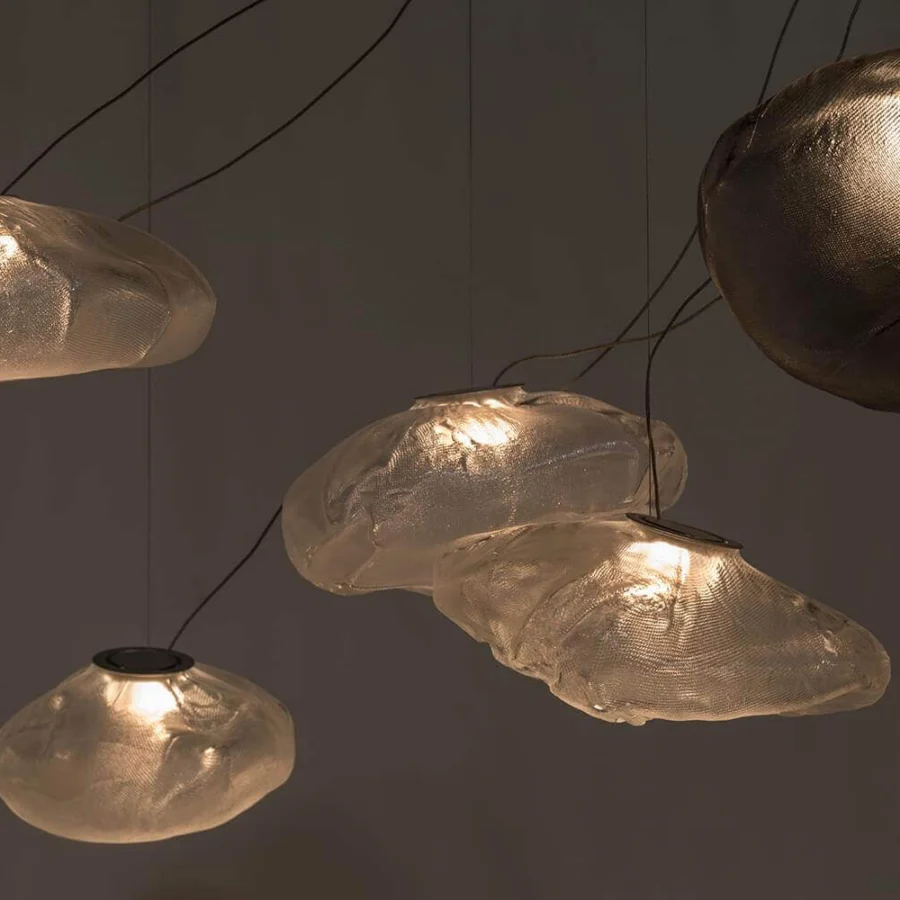 Exclusive Bocci 73 sculptural lamp crafted in light-colored blown glass with a glossy finish and braided metal coaxial cable