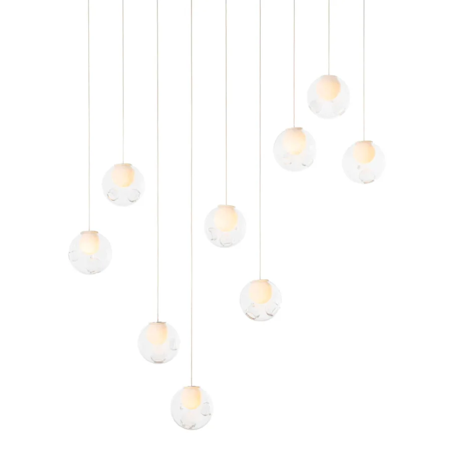 Captivating Bocci 28 Linear suspension lamp crafted in clear glass with milk white interior lamp holder cavities and light-colored cables