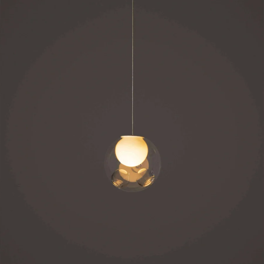 Elegant Bocci 28 single suspension lamp with clear glass exterior and milk white interior lamp holder cavity