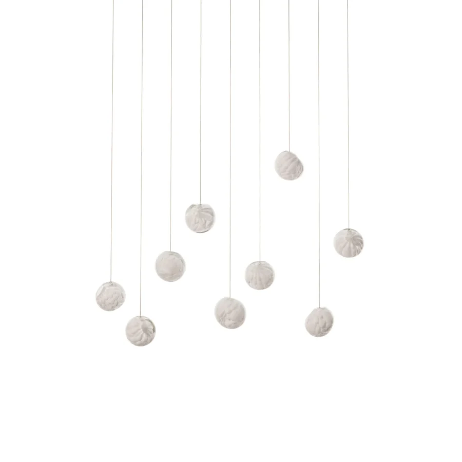 Distinguished Bocci 118 Linear Suspension Lamp with nine hand-blown glass pendants and matte textured form in pale off-white tone