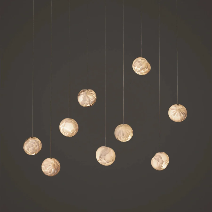 Lavish Bocci 118 Linear Suspension Lamp with nine hand-blown glass pendants exhibiting a satin finish and floral texture