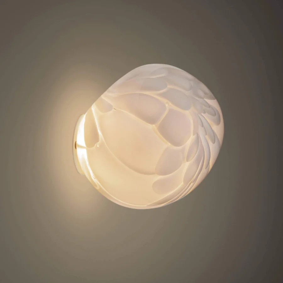 Superior Bocci 118 wall/ceiling lamp with dozens of feather-like forms in opal glass and a brass finish presenting a contemporary style