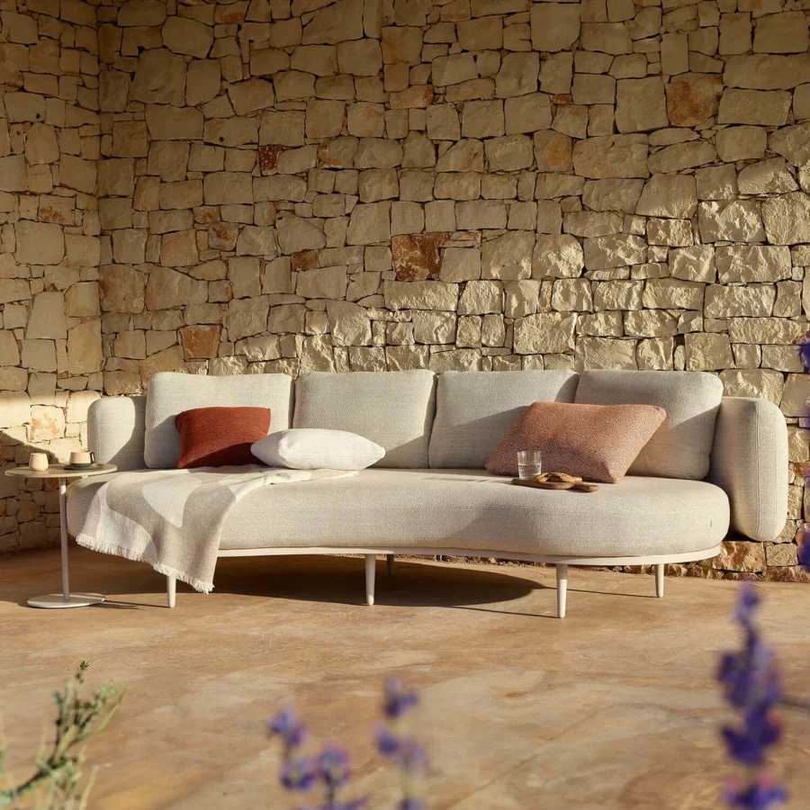 Exceptional Royal Botania Organix lounge sofa with light gray textured upholstery and reddish-brown accent pillows