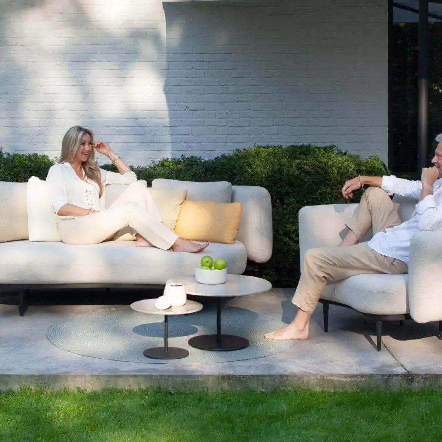 Captivating Royal Botania Organix Lounge sofa with light beige textile upholstery and sleek black aluminum base