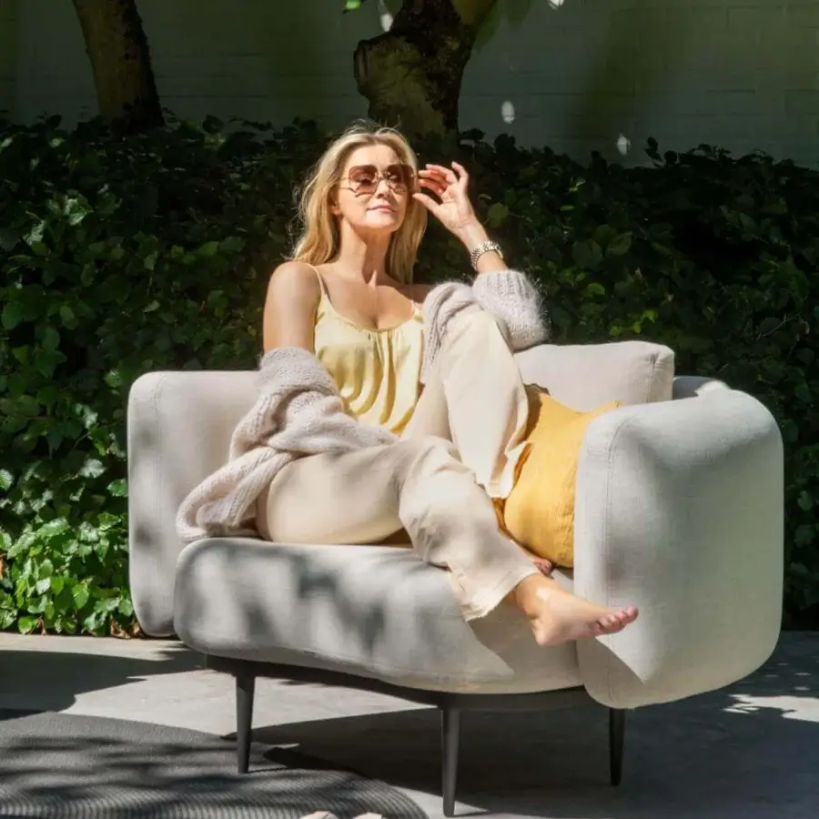 Superior Royal Botania Organix lounge chair with light gray textile, dark metal legs and vibrant yellow decorative pillow