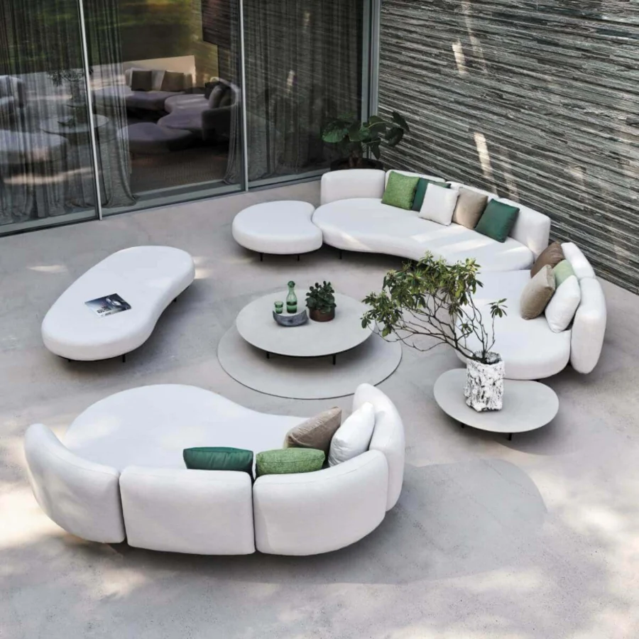Distinguished Royal Botania Organix lounge sectional with organic shapes upholstered in matte white textile and accented with green beige pillows