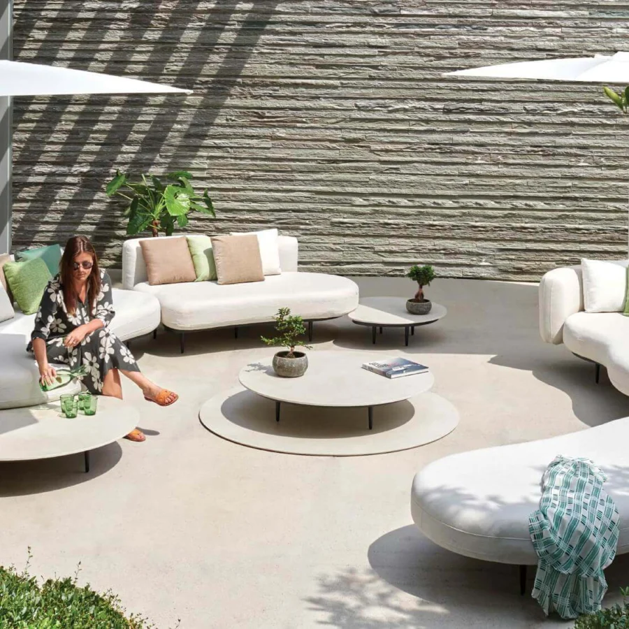 Superior Royal Botania Organix Lounge sectional with kidney shapes upholstered in white textile and calming green cushions with a dark metal base