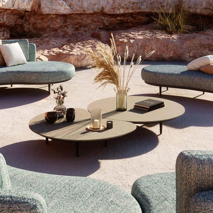 Exceptional Royal Botania Organix lounge table with shaped aluminum base and curved ceramic top in light brown matte finish