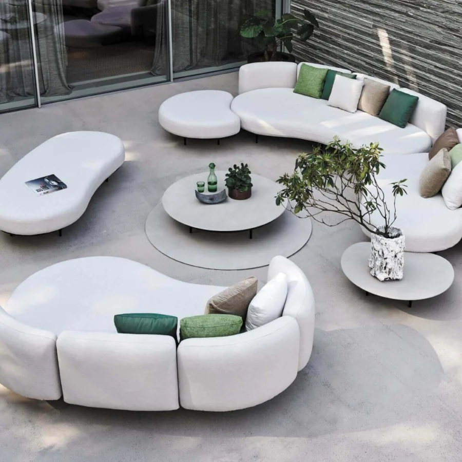 Distinguished Royal Botania Organix lounge coffee table with shaped aluminum base and curved white ceramic top in smooth matte finish