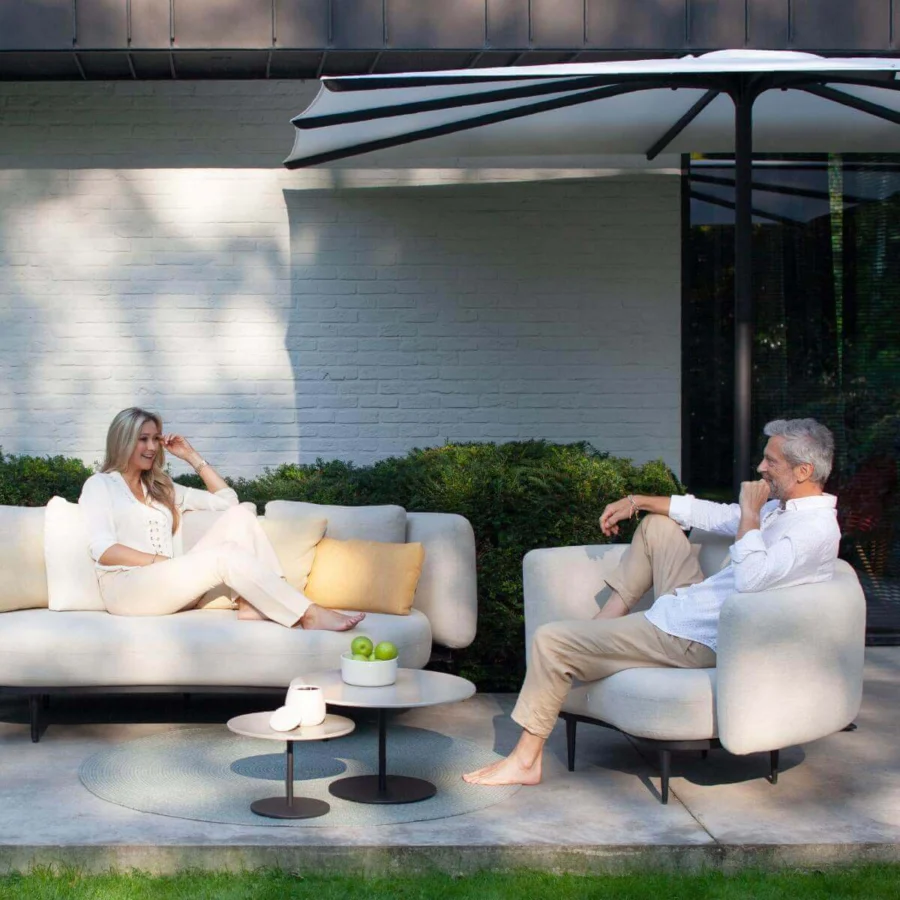 Distinguished Royal Botania Bloom umbrella with a white canopy and black accents crafted in durable aluminum ribs with a stainless steel pole