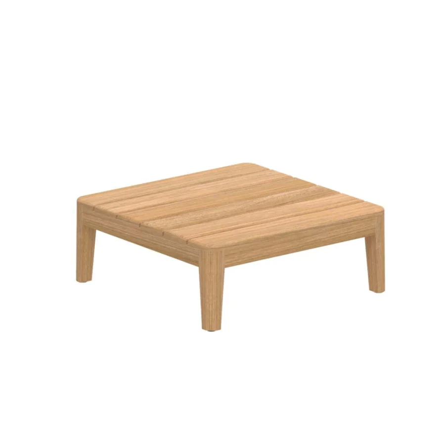 Distinguished Royal Botania Calypso lounge coffee table built in teak wood with a smooth light brown finish and seamless legs