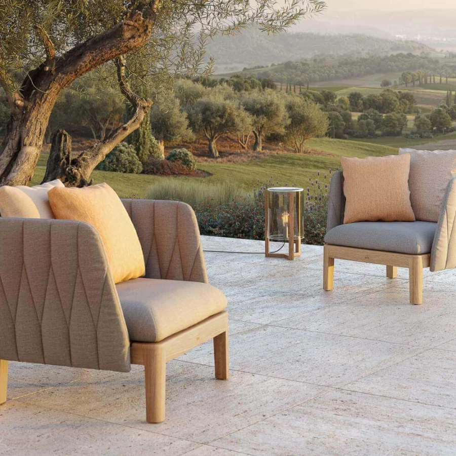 Sophisticated Royal Botania Calypso lounge chair with quilted light grey textile and stainless steel, built with a light matte teak base