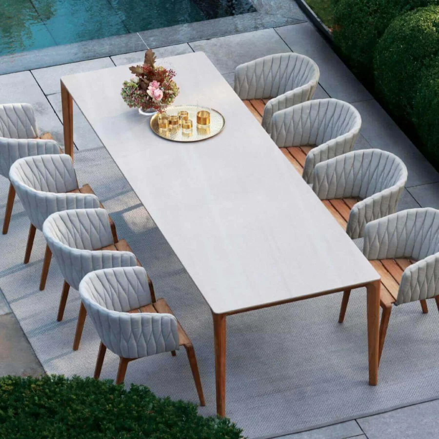 Superior Royal Botania Calypso armchair in light gray quilted textile with teak base and stainless steel backrest