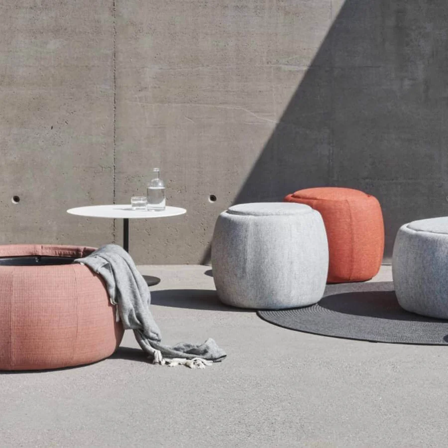 Elegant Royal Botania Tono ottoman in light pink textile with matte finish reveals storage crafted from molded plastic