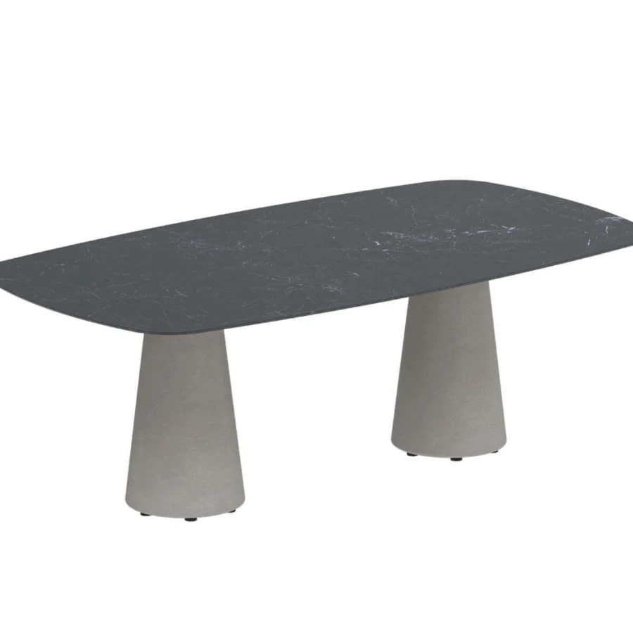 Distinguished Royal Botania Conix table with a dark, marble-like concrete top and light gray, textured Ductal® concrete conical bases