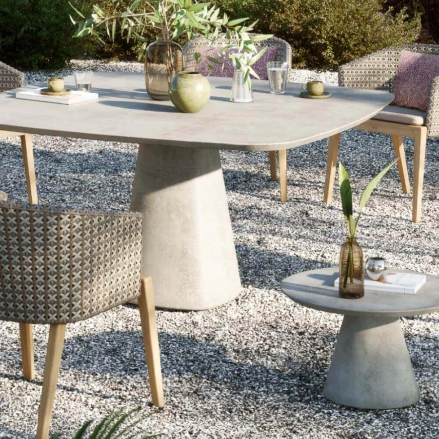 Elegant Royal Botania Conix side table with conical base and round top crafted in light gray matte Ductal® concrete
