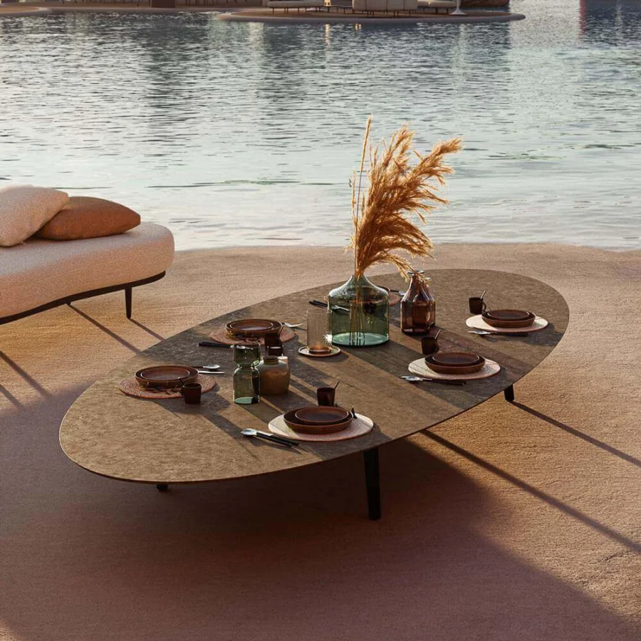 Exceptional Royal Botania Styletto coffee table with elongated oval ceramic top and dark coated aluminum legs in a matte finish