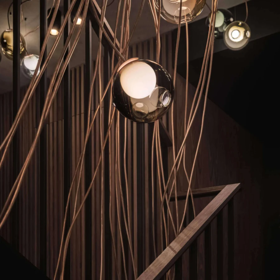 Superior Bocci 28 Copper suspension lamp crafted in clear glass with a milk white interior and natural copper construction