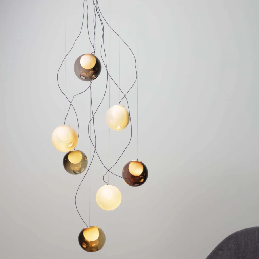 Exceptional Bocci 28 sculptural lamp with hand-blown glass pendants in gold, amber, and pale yellow tones with slender black cables