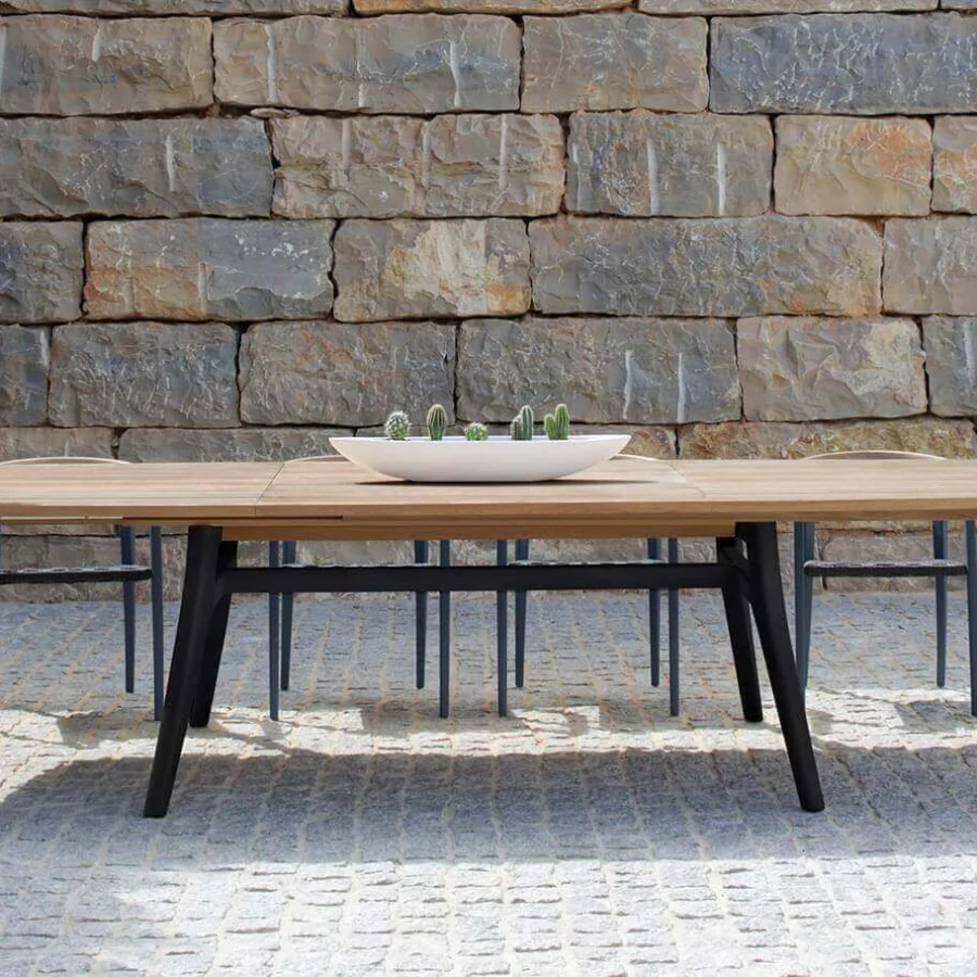 Superior Royal Botania Zidiz table built with teak wood and a dark metal frame in a contemporary smooth finish