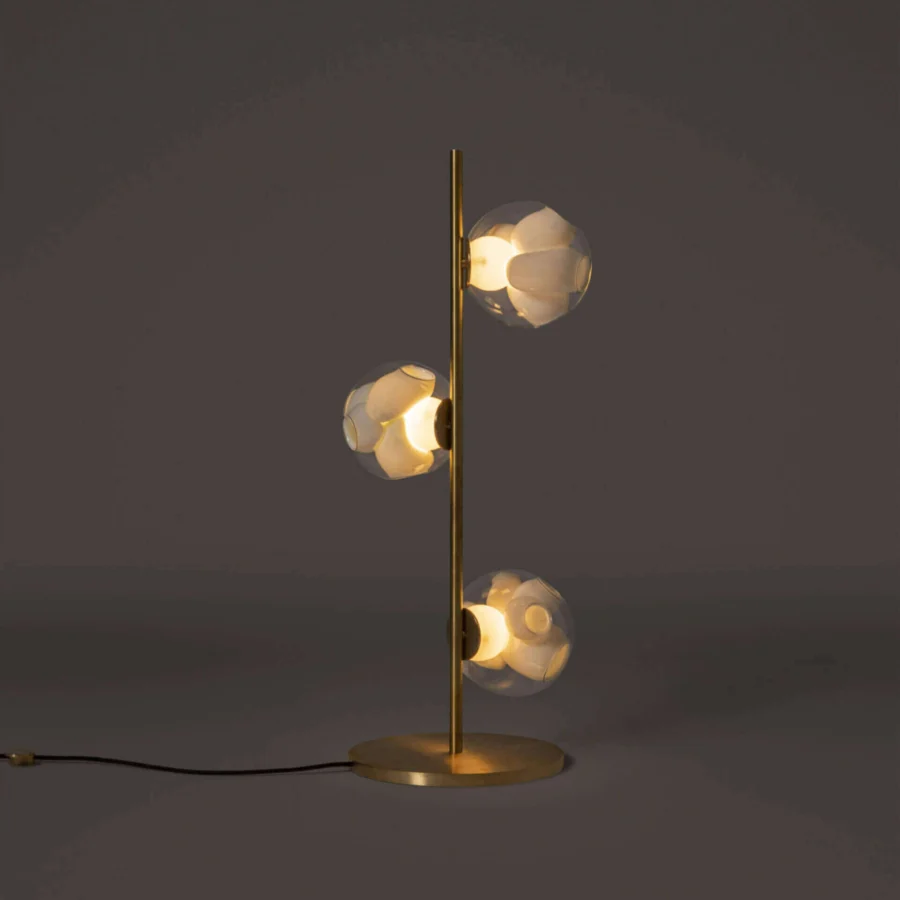 Captivating Bocci 38V Stem floor lamp with brass finish and clear glass exterior paired with milk white interior cavities