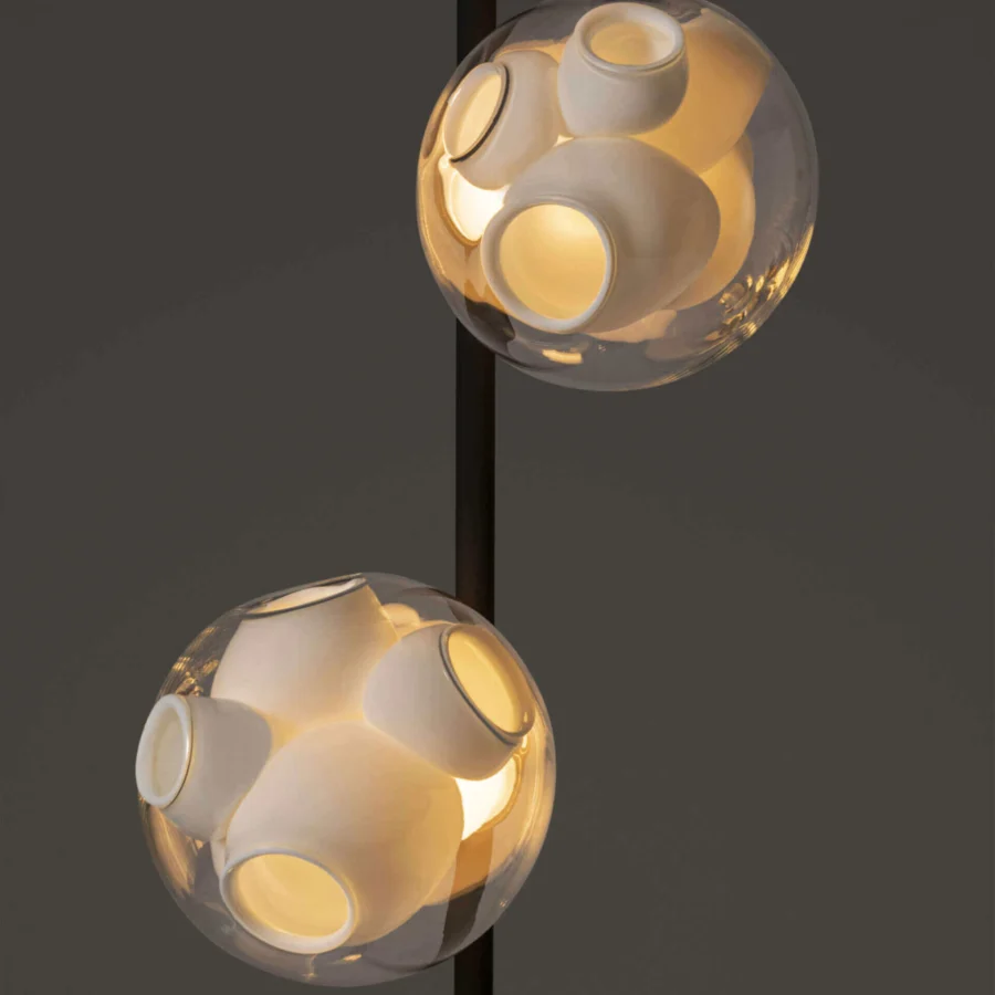 Exceptional Bocci 38V Stem floor lamp with clear glass exterior revealing milky white interior cavities and sleek brass structure