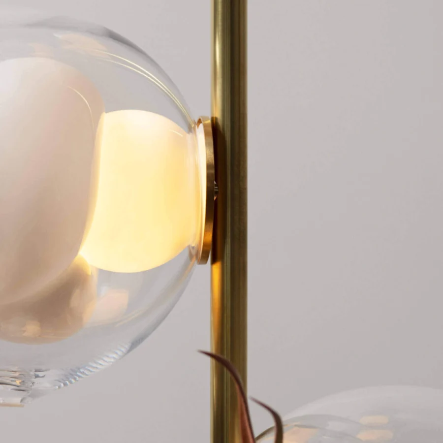 Distinguished Bocci 38V Stem floor lamp with clear glass exterior and milk white interior lamp holder cavities in polished gold brass