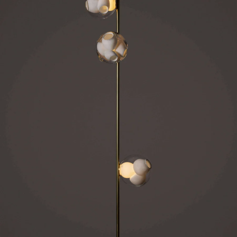 Exclusive Bocci 38V Stem lamp with descending clear glass shades and a brass finish creating diffused light