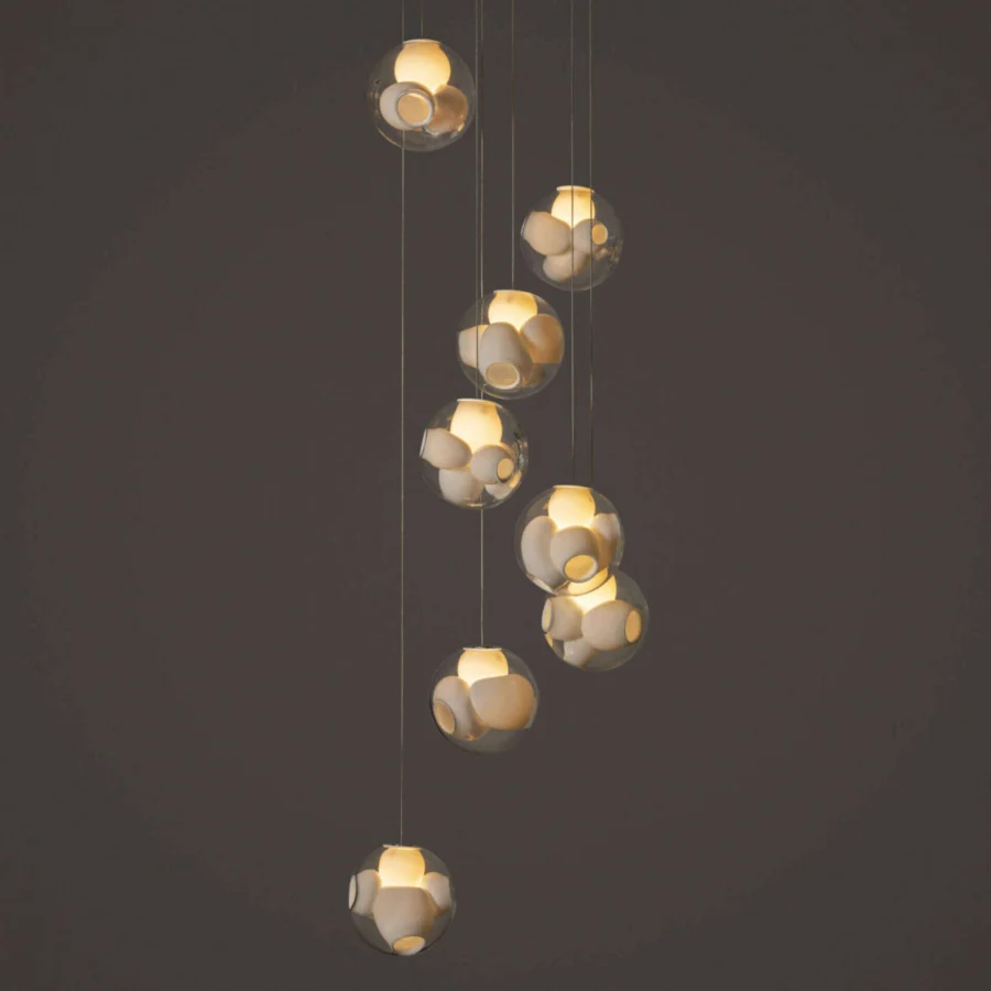 Elegant Bocci 38V Suspension Lamp with hand-blown clear glass spheres and milk white interior cavities along coaxial cables