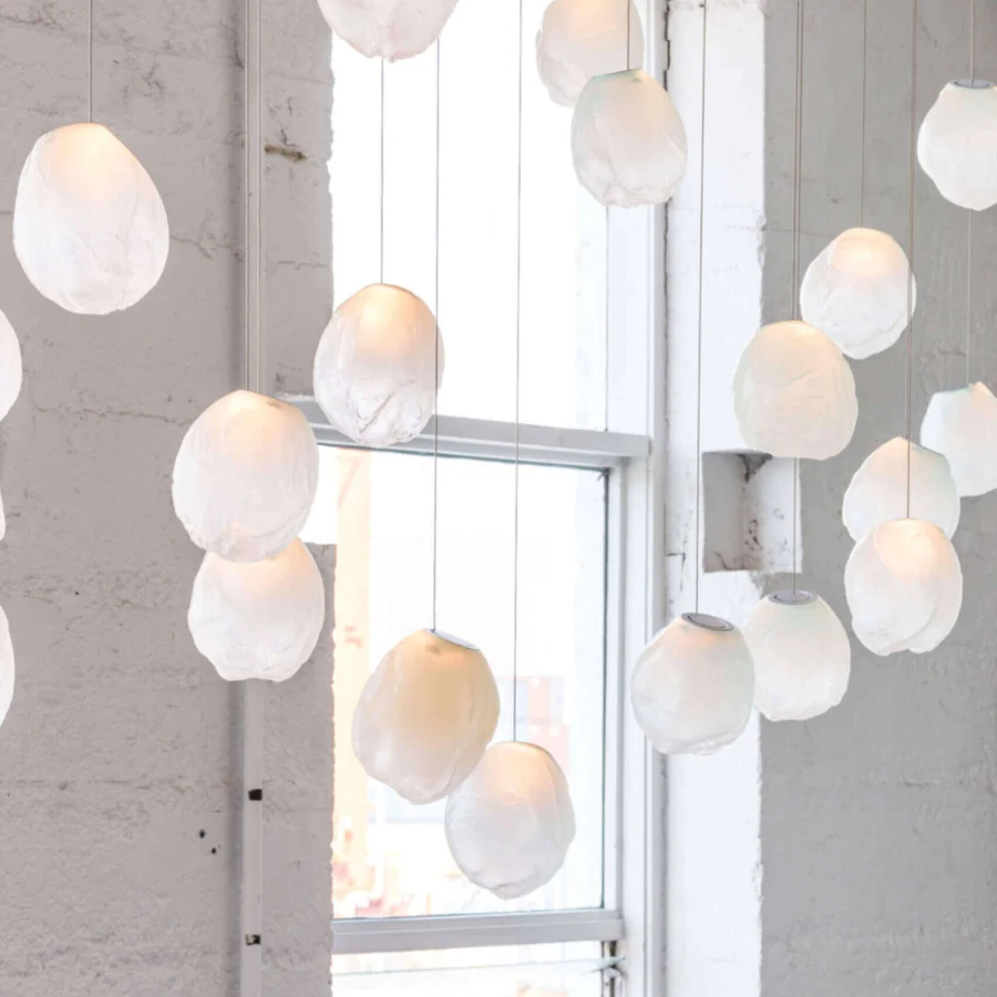 Superior Bocci 73V single suspension lamp crafted in translucent off-white glass with a sleek braided metal coaxial cable and brushed nickel canopy