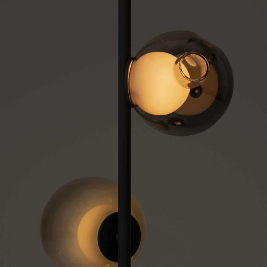 Exclusive Bocci 28 Stem Floor Lamp with a slender matte black metal stem and distorted smoky glass shades