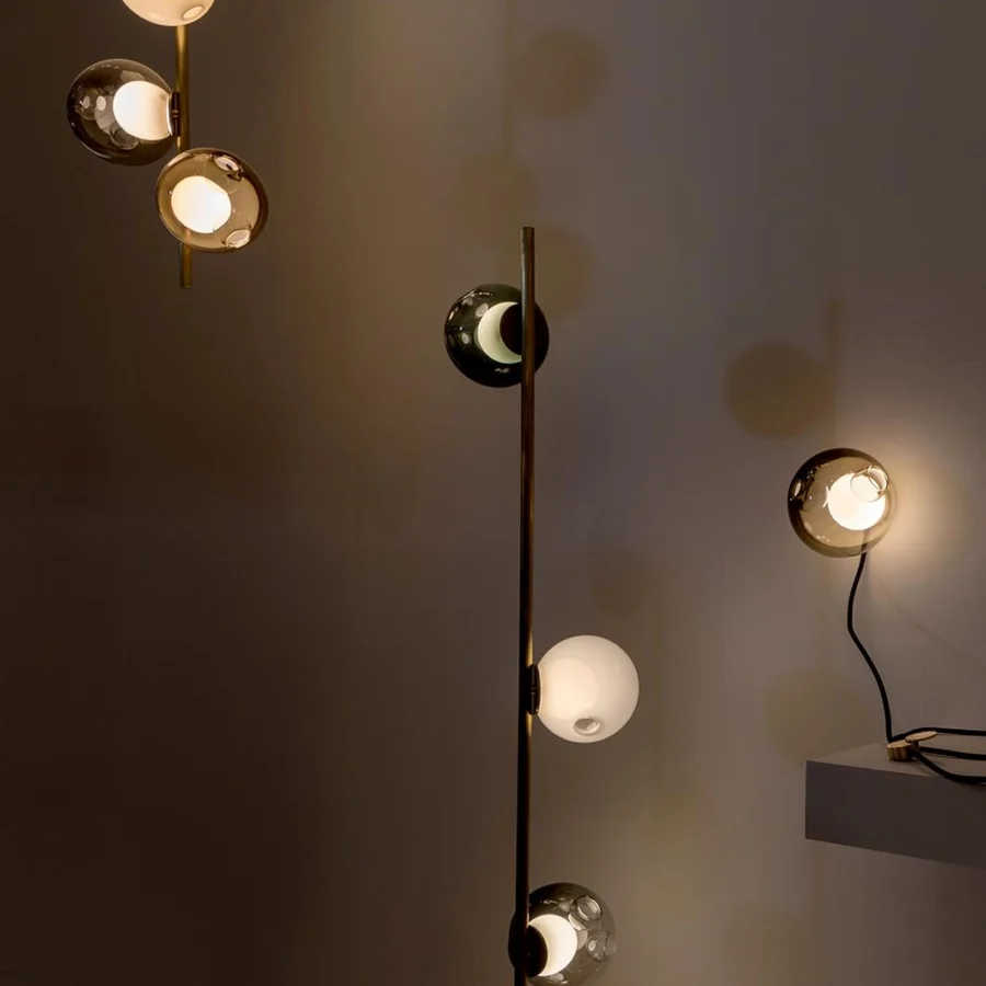 Distinguished Bocci 28 Stem Floor Lamp with a tall brass stem supporting uniquely distorted clear and milk white glass spheres crafted with complex techniques