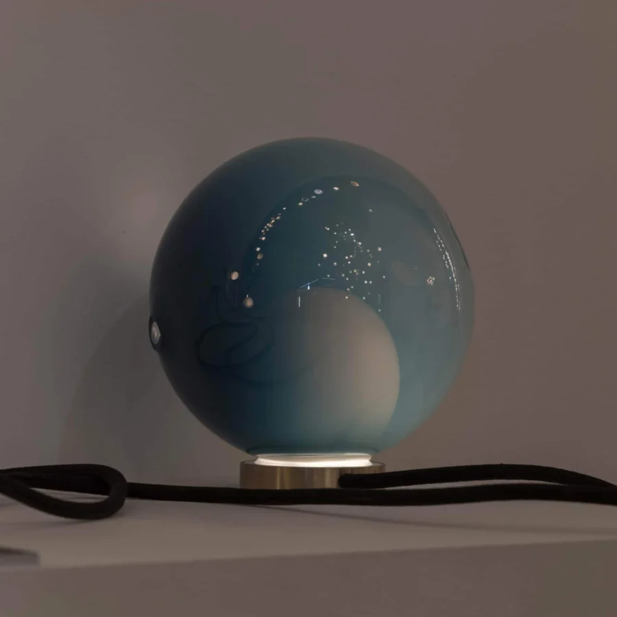 Exceptional Bocci 28 table lamp with a teal blown glass shade and sleek brass base crafted with reflective detailing