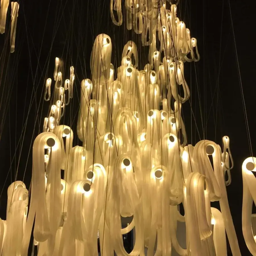 Captivating Bocci 87 Random suspension lamp with cascading elements diffusing warm white light in super heated glass