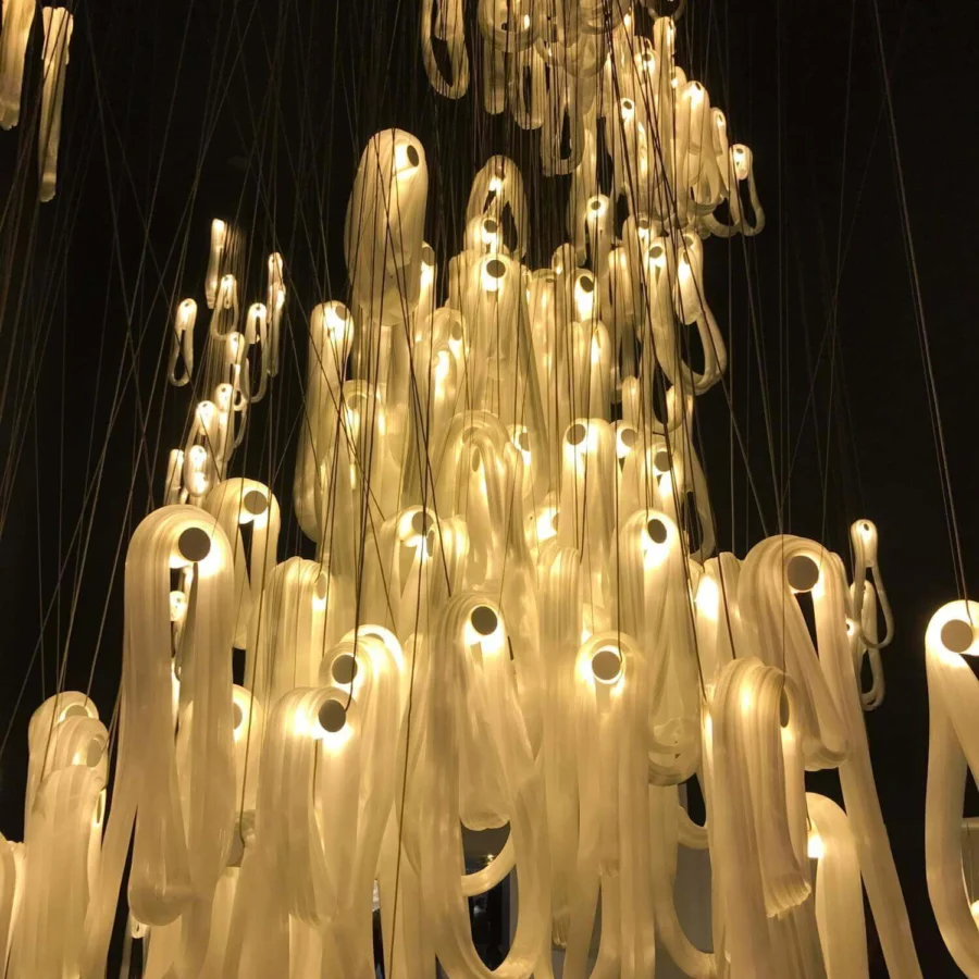 Captivating Bocci 87 Random suspension lamp with cascading elements diffusing warm white light in super heated glass