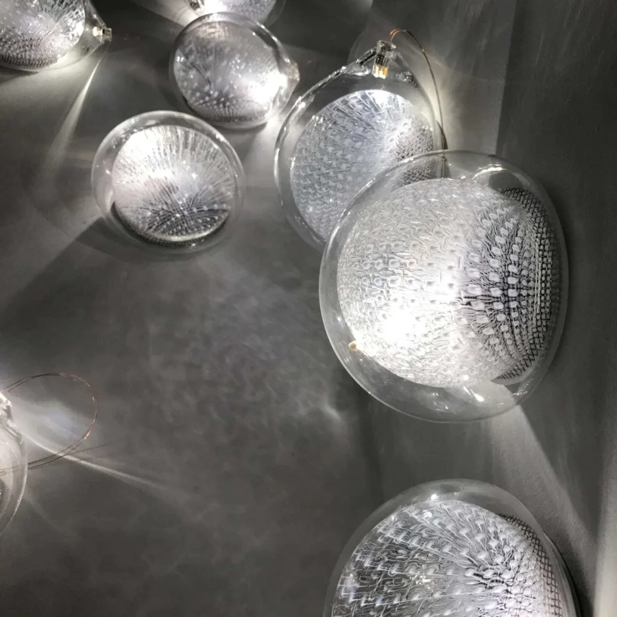 Elegant Bocci 76 Surface Light fixture crafted in hot white and clear glass with delicate copper mesh detailing