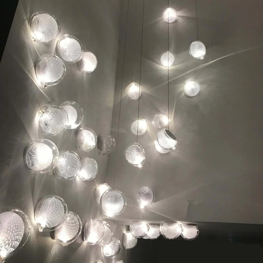 Exceptional Bocci 76 Surface Light lamp with suspended tendrils within white glass and copper mesh