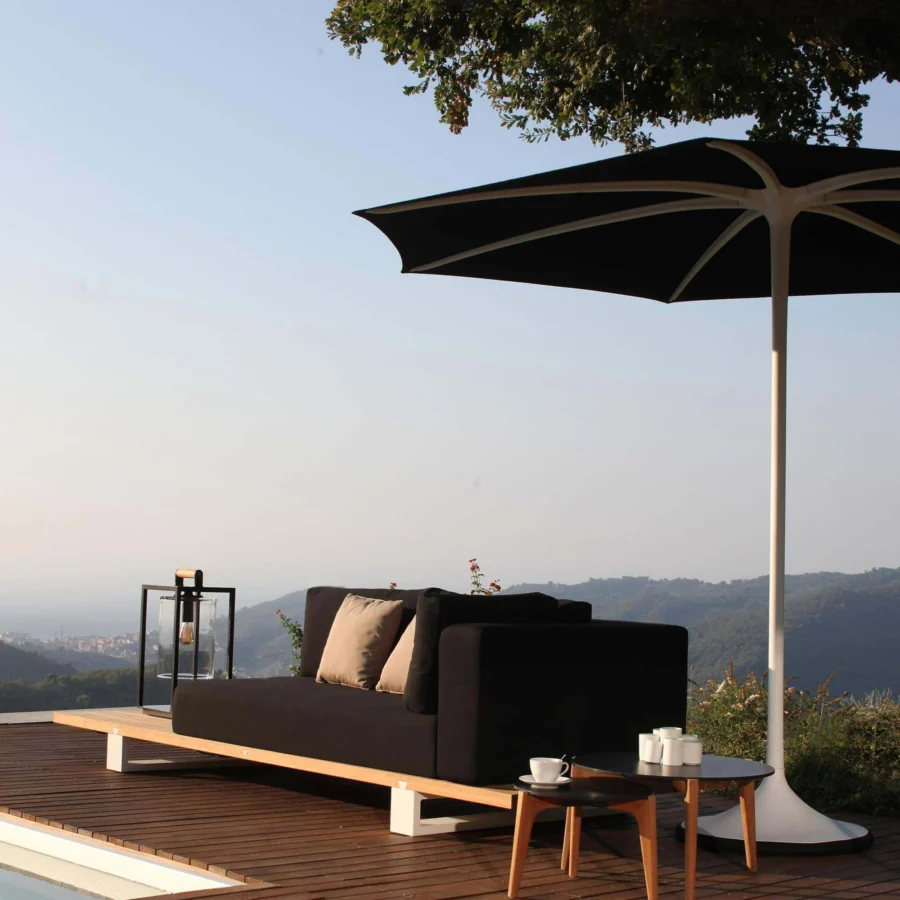 Superior Royal Botania Palma umbrella, a strutless shade with woven black acrylic fiber and white powder-coated aluminum pole